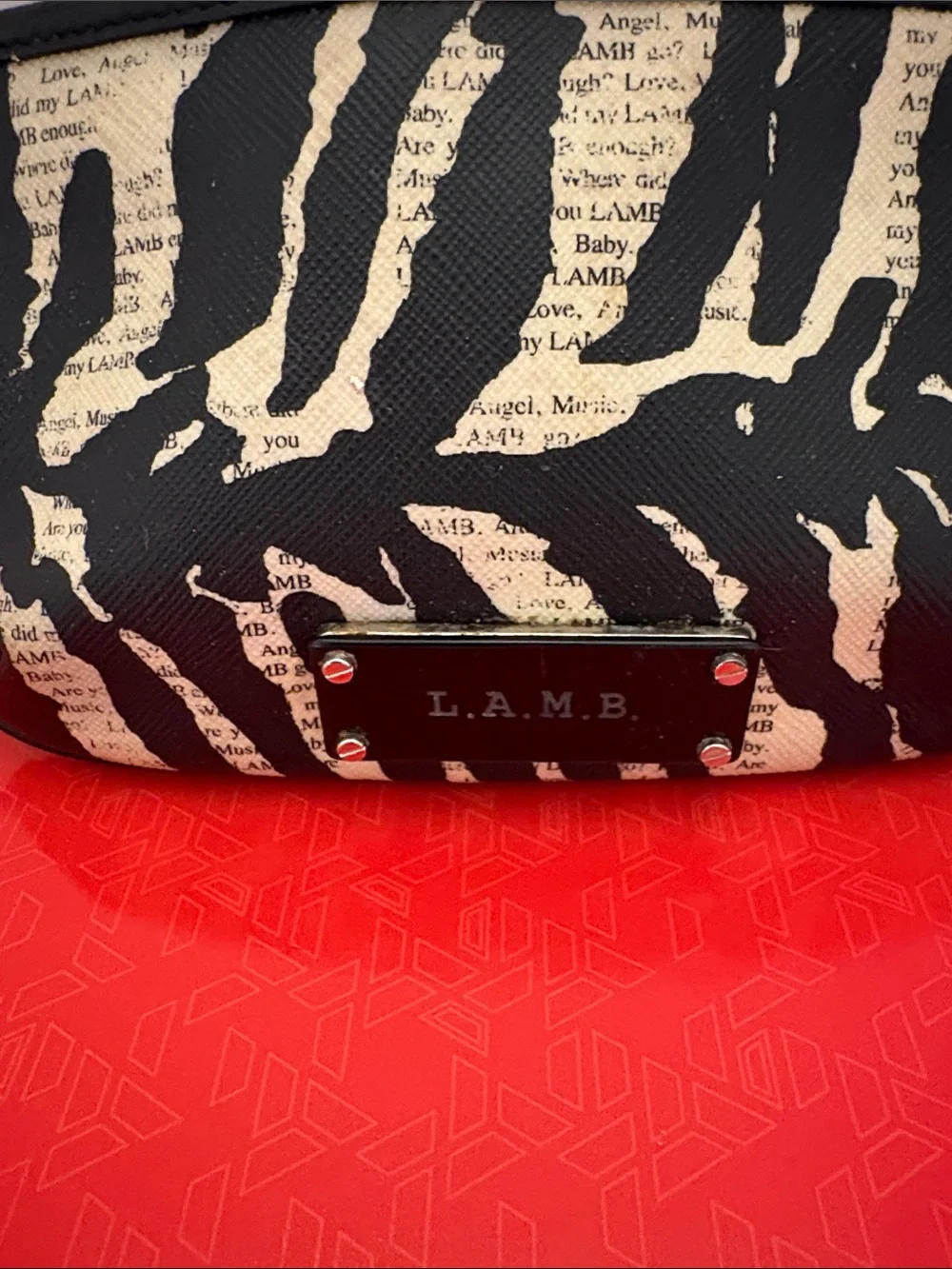 L.A.M.B. Black and Cream Zebra-Print Clutch with Logo Plate